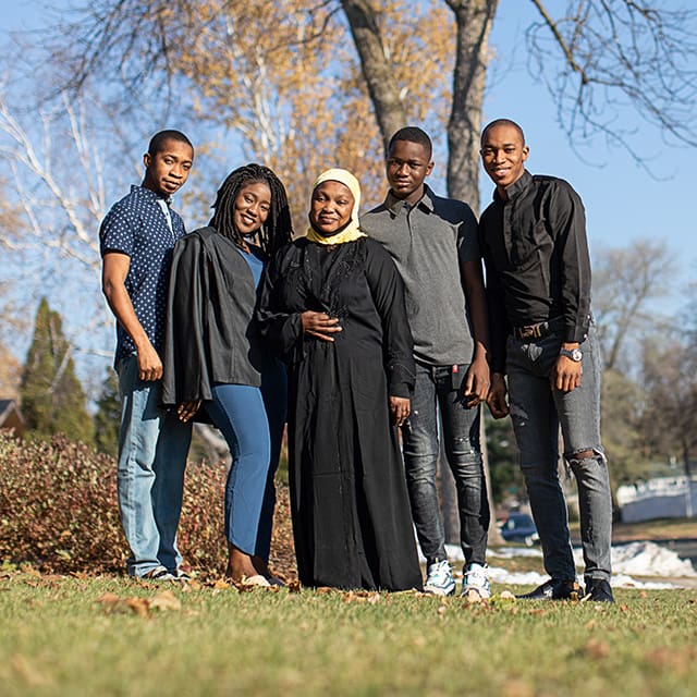 A family standing together and smiling
