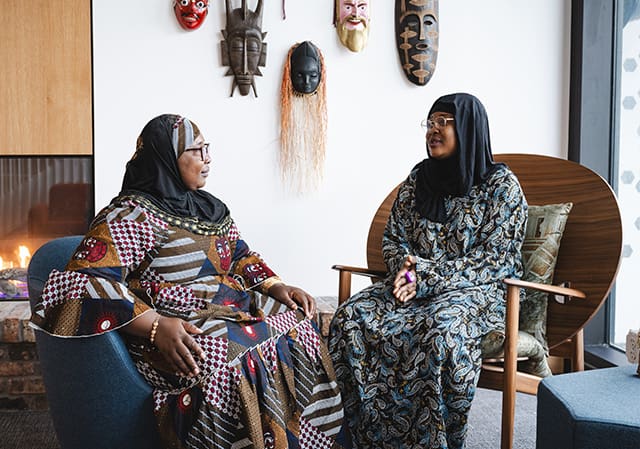 Two woman in hijabs talking