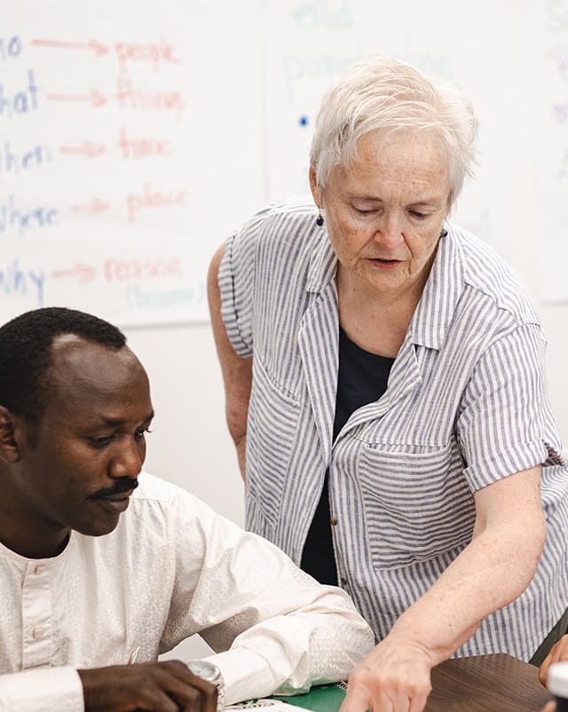 Teacher helping out a student with a problem