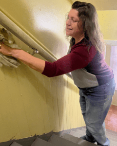 A woman cleaning a stairway
