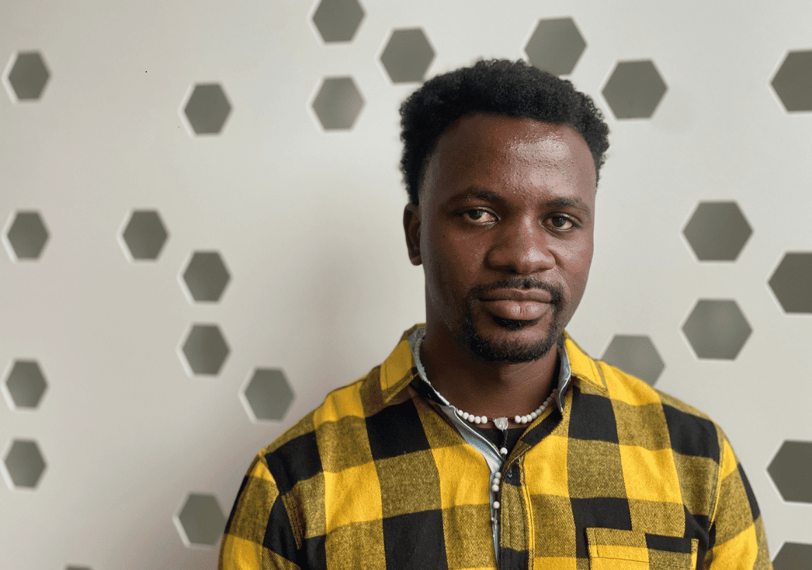 A man with a yellow and black shirt